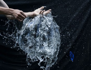 Photo Of Person Popping A Balloon