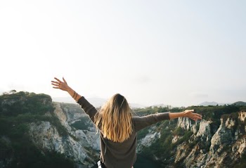 photo of person raising hands