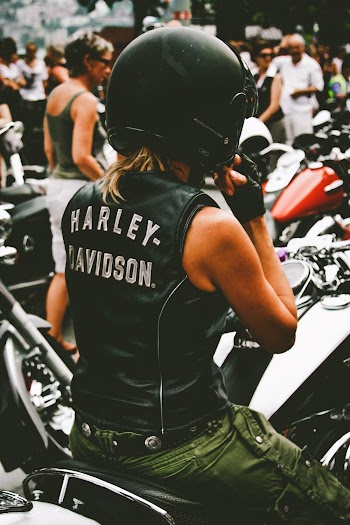Photo of Person Riding Harley Davidson Motorcycle