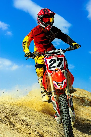 Photo of Person Riding Motocross Dirt Bike