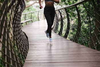 Photo Of Person Running On Bridge