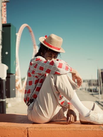 Photo Of Person Sitting On Pavement