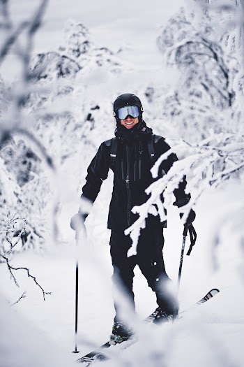 Photo of Person Smiling While Skiing