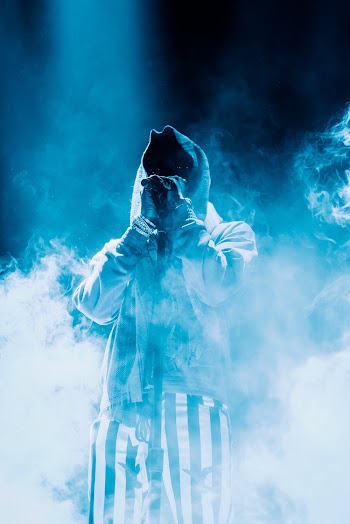 Photo Of Person Standing Around Smokes