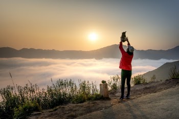 Photo Of Person Standing Near Sea Of Clouds