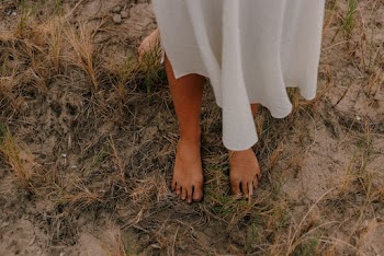 Photo Of Person Standing On Grass