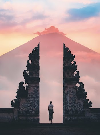 Photo of Person Standing on Temple