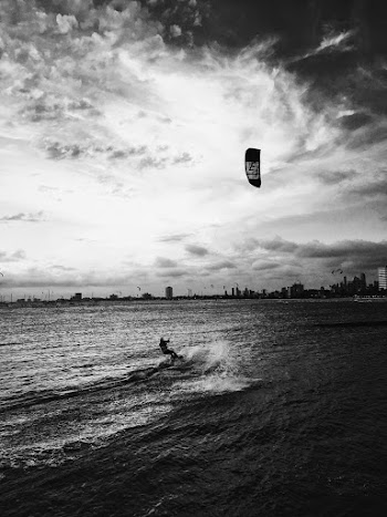 Photo of Person Surfing on Sea