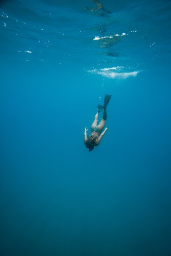 Photo Of Person Swimming Underwater