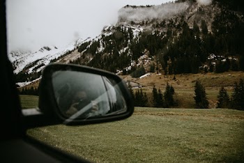 Photo of Person Taking Photo Inside Vehicle