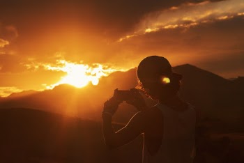 Photo of Person Taking Picture Of Sunset