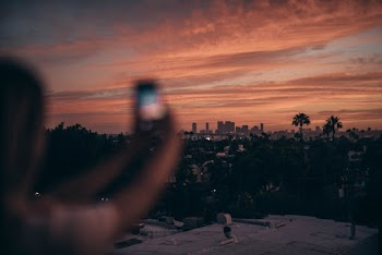 Photo Of Person Taking Pictures During Dawn