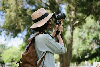 Photo of Person Using Digital Camera