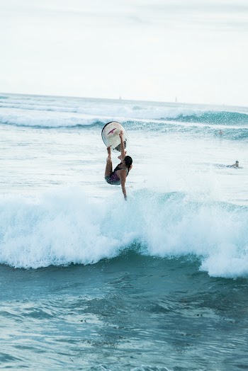 Photo Of Person Using Surfboard
