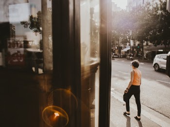 Photo Of Person Walking On Pavement