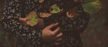 Photo of Person Wearing Black and White Floral Long-sleeved Shirt With Leaves All over in Top