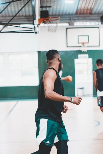 Photo Of Person Wearing Black Tank Top