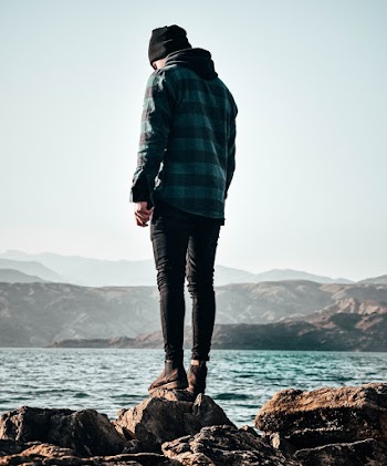 Photo of Person Wearing Blue and Black Plaid Hoodie