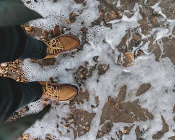 Photo of Person Wearing Brown Leather Shoes