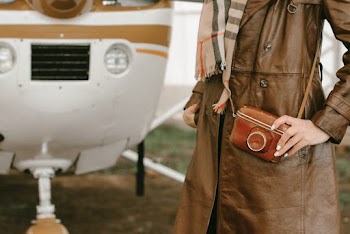 Photo of Person Wearing Brown Trench Coat