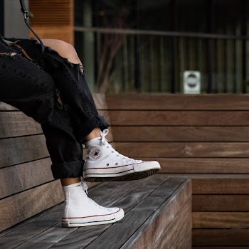 Photo of Person Wearing Chuck Taylor