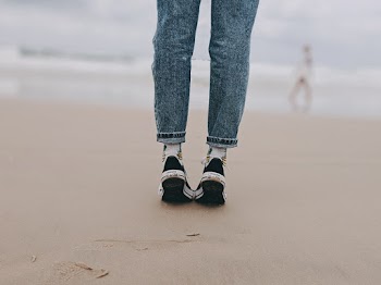 Photo of Person Wearing Denim Jeans