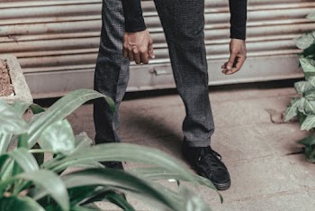 Photo of Person Wearing Gray Plaid Pants