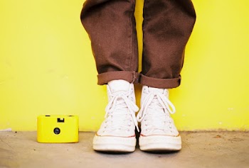 Photo of Person Wearing Sneakers