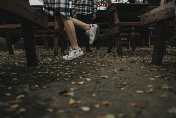Photo of Person Wearing Sneakers