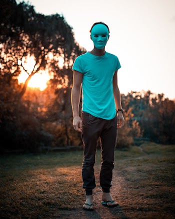 Photo of Person Wearing White Mask