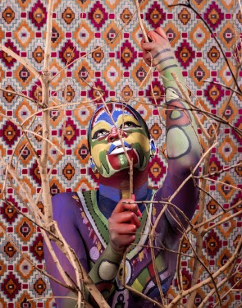 Photo of Person With Face and Body Paint