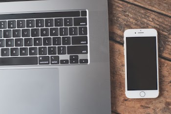 Photo Of Phone Beside Laptop