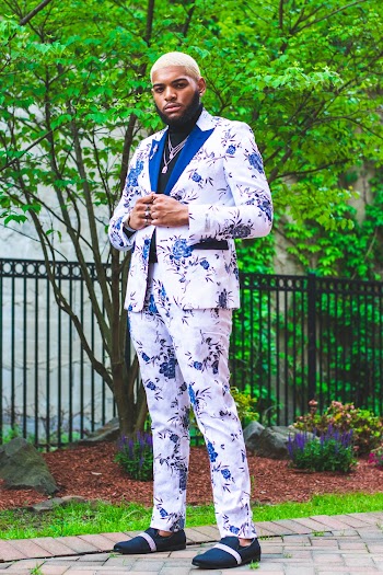 Photo of Posing Man in White Floral Suit