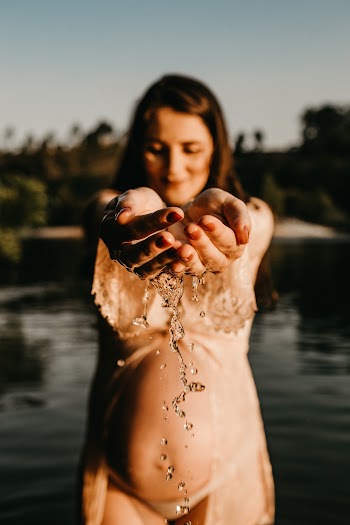 Photo Of Pregnant Woman Holding Water