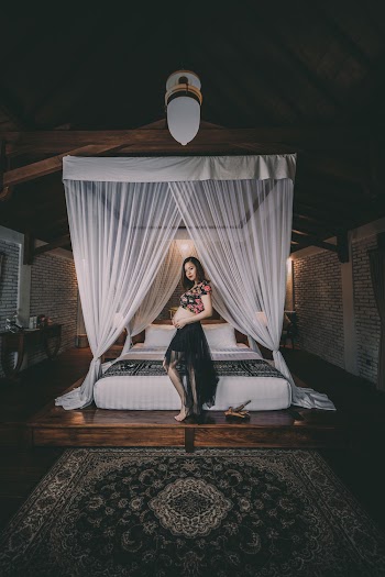 Photo Of Pregnant Woman Near Bed