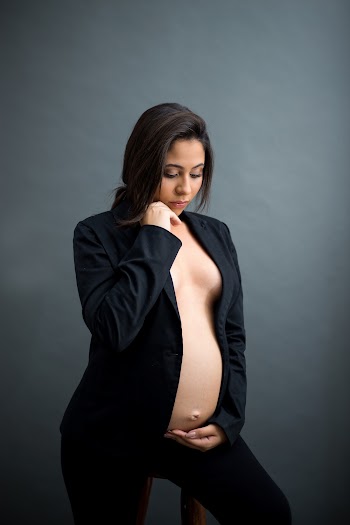 Photo of Pregnant Woman Sitting On Stool