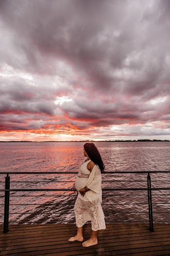 Photo Of Pregnant Woman Standing On Bay