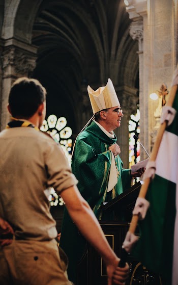 Photo of Priest Standing on Cathedral