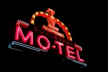 Photo of Red and Orange Motel Neon Signage