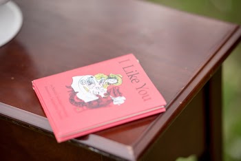 Photo of Red Book on Top of Wooden Desk