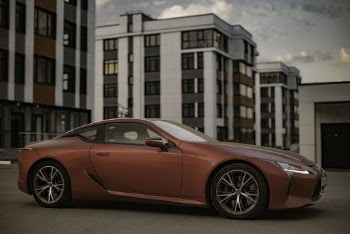 Photo of Red Coupe Parked in Pavement