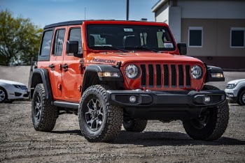 Photo of Red Rubicon Parked On Dirt Road