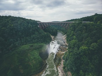 Photo of River Flowing Under Bridge