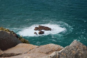 Photo Of Rock Formation On Sea During Daytime