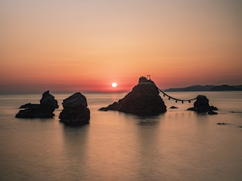 Photo of Rock Formations on Body of Water
