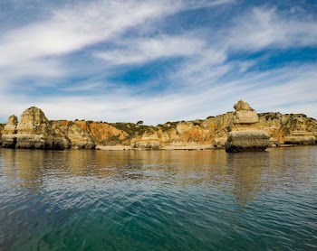 Photo of Rock Formations Under Cloudy Sky
