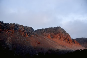 Photo of Rocky Mountain Under Cloudy Sky