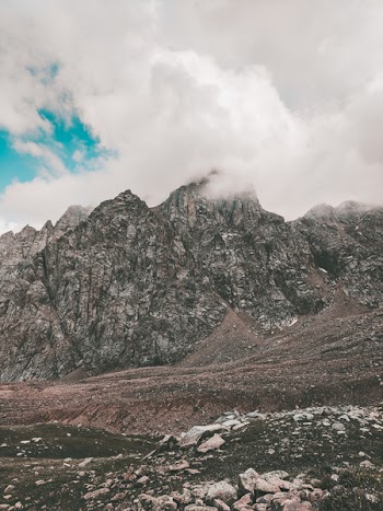 Photo of Rocky Mountain Under Cloudy Sky