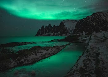 Photo of Rocky Mountains Under Night Sky