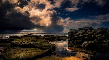 Photo of Rocky Seashore During Golden Hour